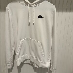 Woman’s white Nike hoodie